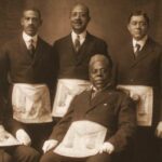 Harry A. Williamson (standing, far right) and five fellow members of the Carthaginian Lodge no. 47 | Born October 25, 1875