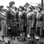 Women's Army Corps Maj. Charity Adams, 6888th Central Postal Directory Battalion commander, and Army Capt. Mary Kearney, Alpha Company commander, inspect the first soldiers from the unit to arrive in England, Feb. 15, 1945.